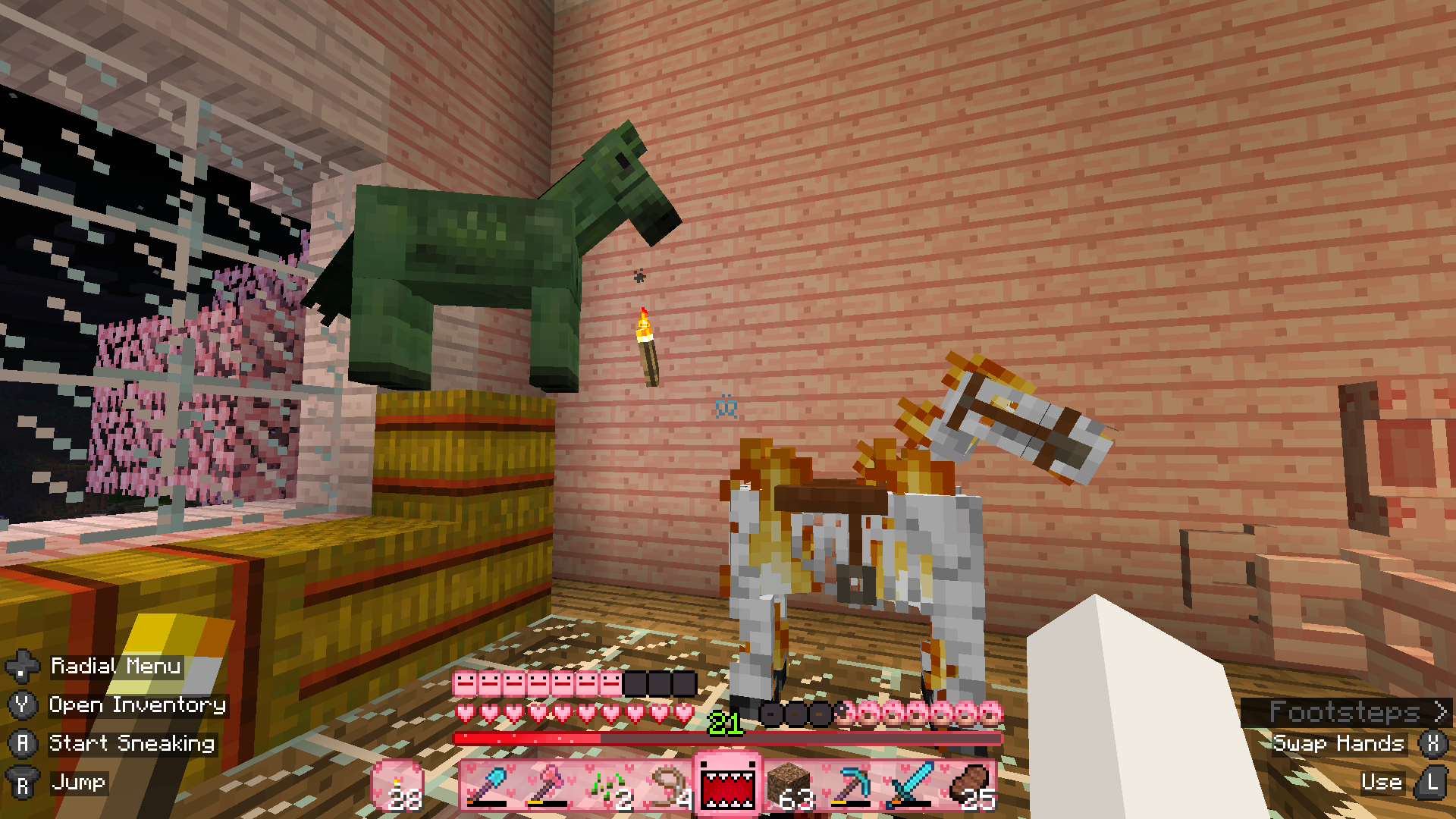 Minecraft screenshot: Ken Kaniff and Slim Shady sharing a pen in my stables. Ken Kaniff is looking down on Shady from a stack of hay bales.